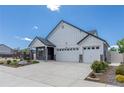 Beautiful single-Gathering home featuring a well-maintained lawn and a spacious three-car garage for convenience at 21701 E 50Th Dr, Aurora, CO 80019