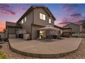 A spacious backyard patio features a covered seating area, perfect for outdoor relaxation at 9650 Raven St, Firestone, CO 80504