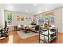 Inviting living area with hardwood floors, a comfortable sofa, and ample natural light at 2640 Central Ct # 104, Denver, CO 80211