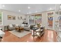 Open living space with hardwood floors, neutral-toned furniture, and bright, natural light at 2640 Central Ct # 104, Denver, CO 80211