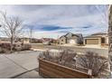 Residential street showcasing similar homes and landscaping at 12432 Meadowlark Ln, Broomfield, CO 80021