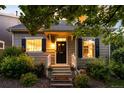 Charming home with well-maintained landscaping and welcoming front porch at 1947 King St, Denver, CO 80204