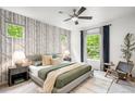Serene main bedroom with tree-patterned wallpaper and plenty of natural light at 1947 King St, Denver, CO 80204