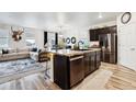 Stylish kitchen featuring a center island, stainless steel appliances, and an open layout at 7227 Clarke Dr, Frederick, CO 80530