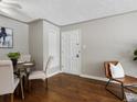 Dining room features hardwood floors, neutral walls, with a round table and four chairs at 2047 S Milwaukee St # 4, Denver, CO 80210