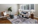 Bright living room featuring hardwood floors, area rug, and a comfortable seating arrangement at 2047 S Milwaukee St # 4, Denver, CO 80210