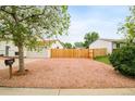 Fenced yard with gravel bed and room for extra parking in the back at 2988 S Hannibal St, Aurora, CO 80013