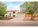 Well-maintained two-story home with white siding and a spacious two car garage at 2988 S Hannibal St, Aurora, CO 80013