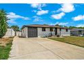 Charming single-story home features a long driveway, painted white brick, and a dark brown roof at 7150 Beach St, Westminster, CO 80030