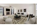 Inviting living room with fireplace, neutral colors, and stylish decor at 22030 Hill Gail Way, Parker, CO 80138