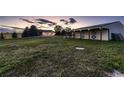 Rural property featuring a house with three car garage and barn with horse stalls at 3487 Willownook Ranch Trl, Elizabeth, CO 80107