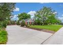 Well-maintained yard featuring healthy green grass and mature trees at 3 Glenview Dr, Littleton, CO 80123