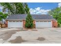 Spacious two-car garage with white doors at 3 Glenview Dr, Littleton, CO 80123