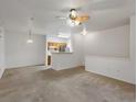 Open-concept living space showcasing seamless transition to the kitchen at 912 S Yampa St # 203, Aurora, CO 80017