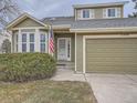 House exterior showcasing a two-car garage and manicured lawn at 2368 W 119Th Ave, Denver, CO 80234