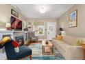 Cozy living room with a fireplace, hardwood floors, and ample natural light at 1215 Jackson St, Denver, CO 80206