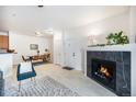 Spacious living area with a cozy fireplace and open layout provides ample room for relaxation and entertaining at 4451 S Ammons St # 4-108, Littleton, CO 80123