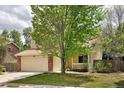 Charming two-story home with a well-manicured lawn, brick accents, and an attached two-car garage at 4860 W 125Th Ave, Broomfield, CO 80020