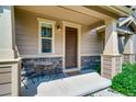 Small front porch with table and chairs at 1567 S Dallas Cir, Denver, CO 80247