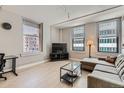 Cozy living room features hardwood floors, large windows, and comfortable seating at 444 17Th St # 701, Denver, CO 80202