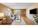 Inviting living room boasting hardwood floors, large windows, and stylish décor at 4616 E Yale Ave, Denver, CO 80222