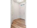 Bright entryway with wood-look flooring and white walls at 1849 S Helena St, Aurora, CO 80017