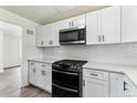 Contemporary kitchen with new cabinets, counter tops and stainless steel appliances at 1032 Geneva, Aurora, CO 80010
