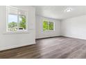 Bright living area with large windows and durable laminate flooring at 1032 Geneva, Aurora, CO 80010