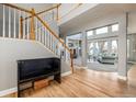 Grand foyer with staircase and open floor plan flowing into the living room at 3685 Roberts St, Mead, CO 80542