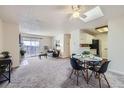 Spacious living area with dining space, open to kitchen and balcony at 2225 S Jasmine St # 304, Denver, CO 80222