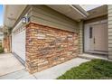Close-up showcasing the stone brick facade and trim work near the front entrance at 3000 E 112Th Ave # 86, Northglenn, CO 80233