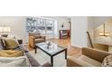 Bright living room featuring hardwood floors and large windows at 5975 S Kearney St, Centennial, CO 80111