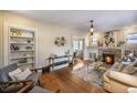 Inviting living room with fireplace, hardwood floors and built-in shelving at 460 S Sherman St, Denver, CO 80209