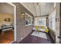 Cozy sun room with brick walls and a comfortable seating area at 460 S Sherman St, Denver, CO 80209