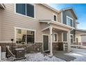 Charming townhouse featuring a covered entry with stone accents, offering a welcoming exterior at 1353 Reynolds St # 16B, Fort Lupton, CO 80621