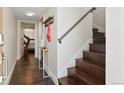 Bright and airy entry with staircase and view into home gym at 2728 W 26Th Ave # 104, Denver, CO 80211