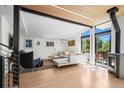 Bright living room with floor-to-ceiling windows, wood floors, and stylish furniture at 2725 6Th St, Boulder, CO 80304