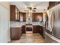Modern kitchen features stainless steel appliances, granite countertops, and custom backsplash at 3659 W Union Ave, Denver, CO 80236