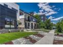 Charming homes nestled in a neighborhood, showcasing manicured lawns and tree-lined streets at 1231 Newton St, Denver, CO 80204