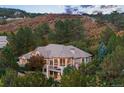 Beautiful two-story home with a balcony, surrounded by mature trees offering privacy and serene living at 724 Evening Star Dr, Castle Rock, CO 80108