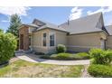 Exterior view of a charming ranch home with stone accents at 22263 E Euclid Dr, Aurora, CO 80016