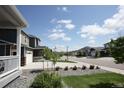 Street view featuring the home's exterior and a well-maintained front yard at 4955 Trails Edge Ln, Castle Rock, CO 80104