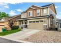 Beautiful home with a well-maintained lawn and attached two-car garage at 21271 E Smoky Hill Rd, Centennial, CO 80015
