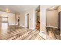 Spacious living room featuring hardwood floors, neutral walls and an open floor plan at 3225 Olive St, Denver, CO 80207
