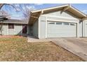 Charming single-story home with a well-maintained lawn, a two-car garage, and beautiful curb appeal at 12062 E Maple Ave, Aurora, CO 80012