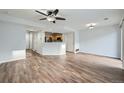 Bright and spacious living room featuring wood flooring and a ceiling fan at 19046 E 57Th Pl # B, Denver, CO 80249