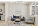 Cozy living room with a comfortable seating arrangement, natural light, and stylish decor at 762 N Rome St, Aurora, CO 80018