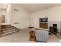 Bright living room features a staircase, wood burning stove, and fireplace at 250 Upper Forest Rd, Idaho Springs, CO 80452
