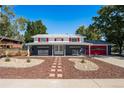 Charming ranch home with red accents and landscaped front yard at 12555 W 61St Ave, Arvada, CO 80004