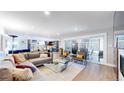 Spacious open floor plan connects the living area to an outdoor patio with ample natural light at 463 Locust St, Denver, CO 80220